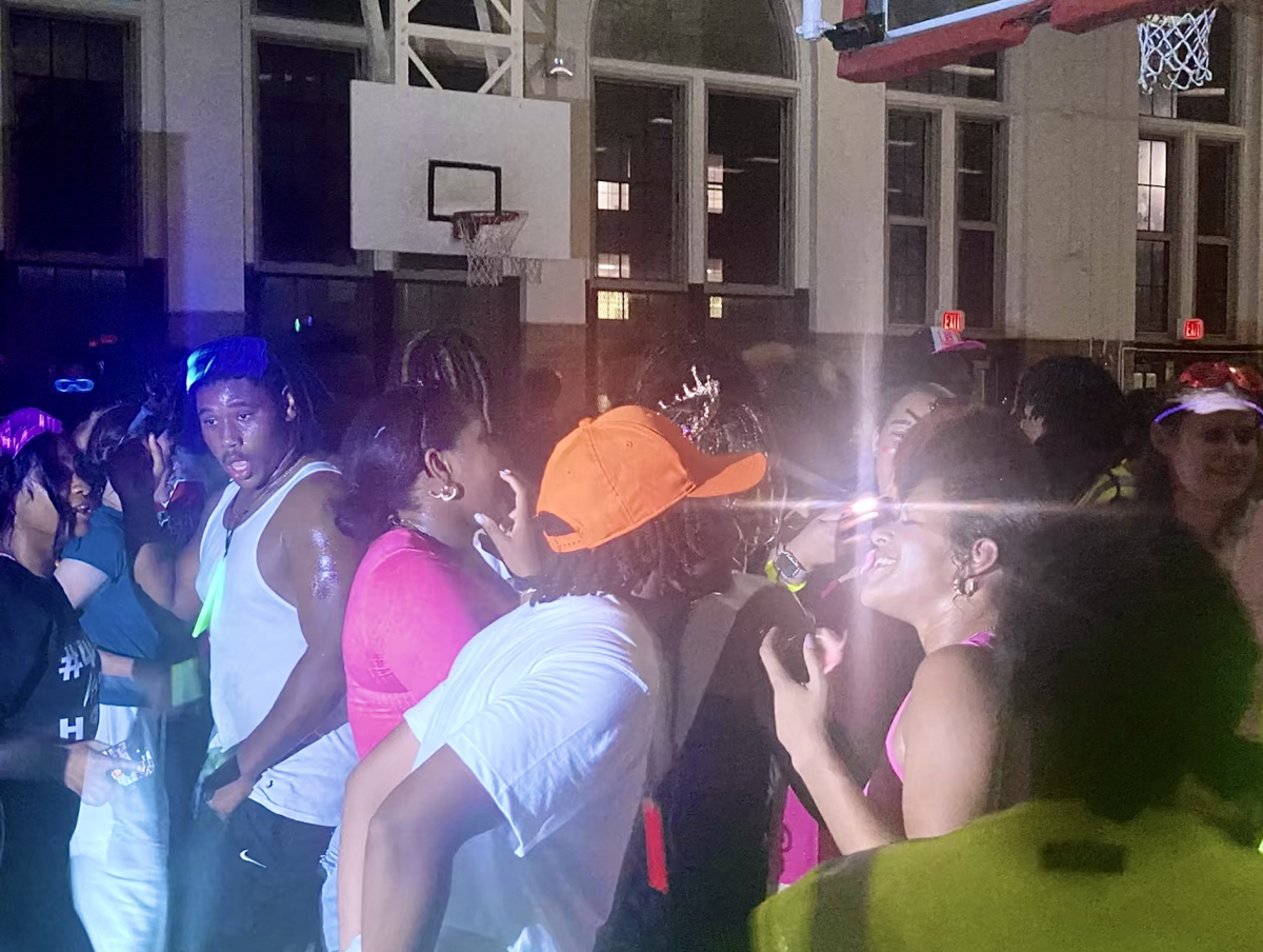 Manual students dance and mingle at homecoming dance. 